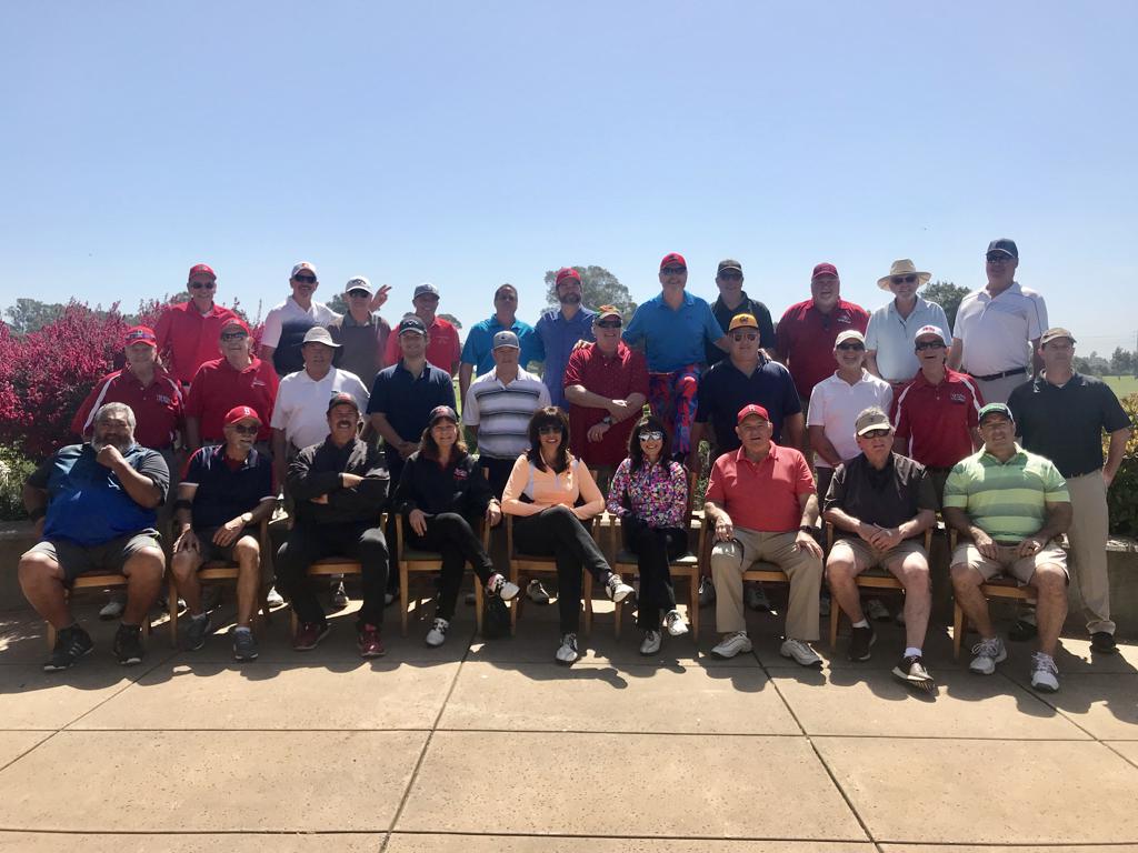 a group photo of golfers